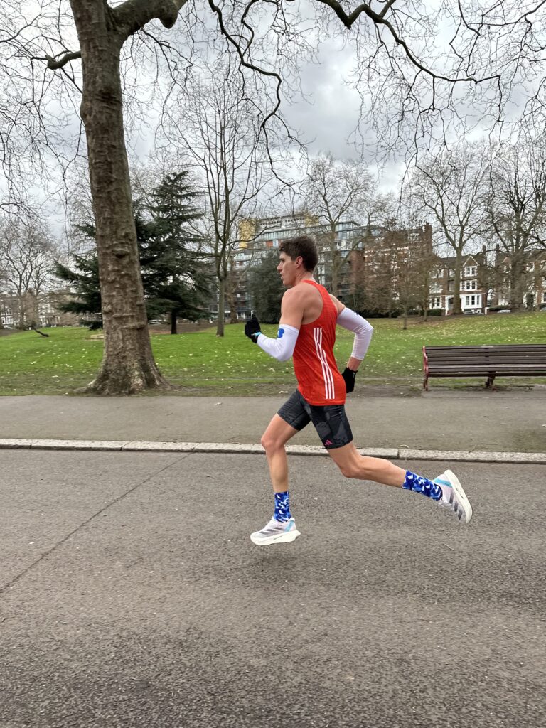 Man running with a long stride.